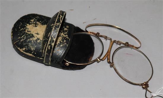 A pair of gold plated folding pince nez.